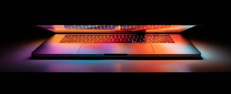 Illuminated laptop on desk