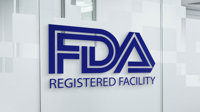 FDA letters on a glass business wall