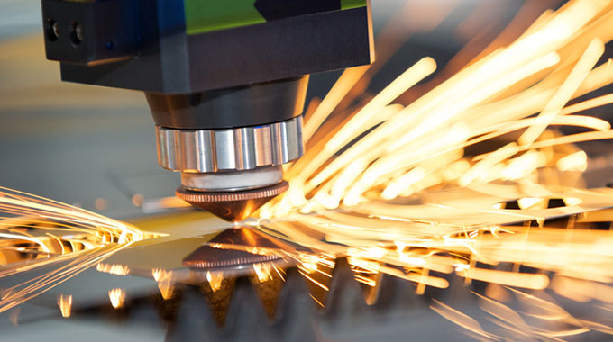 Close-up of CNC machine with sparks